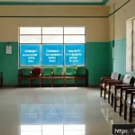 보건소 방문 시 유의사항 - A calm and spacious health center reception area in India during early morning hours, featuring Hind...